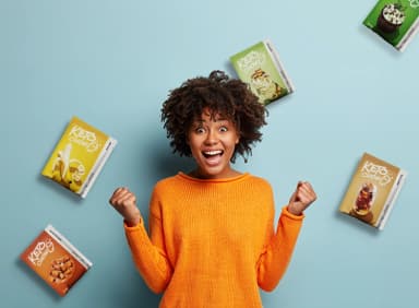 an excited woman surrounded by Keto Chow