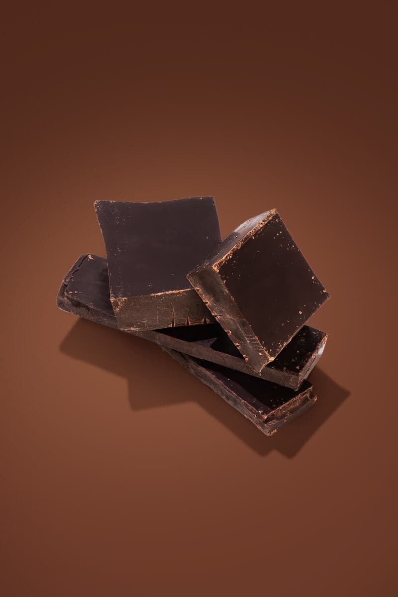 A chocolate bar, cut and stacked artistically