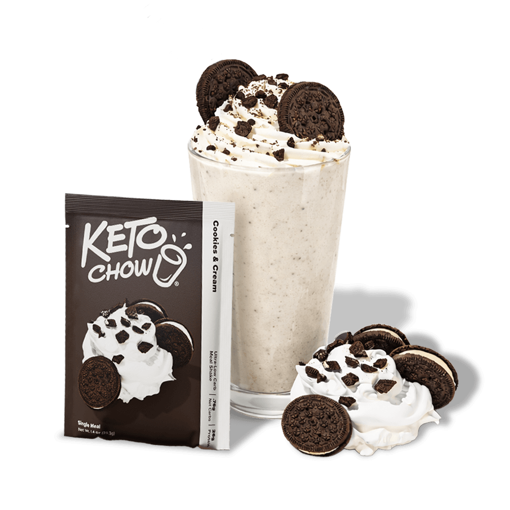 KETO CHOW Cookies & Cream dark brown single meal pouch and white stick packet. A shake in a glass with whipped cream, sandwich cookies, and crumbles. Text: KETO CHOW, Cookies & Cream, Ultra-Low Carb Meal Shake.